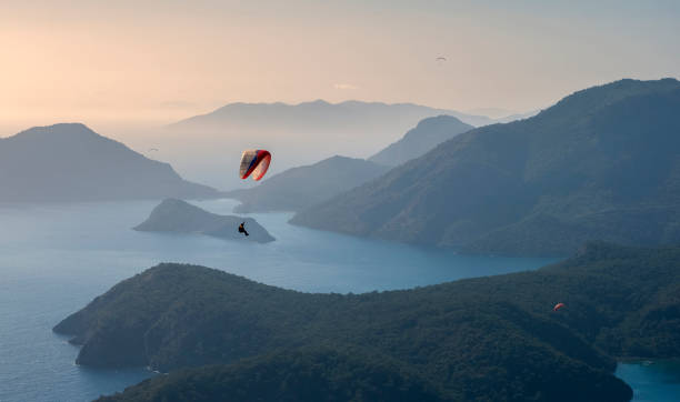 Paragliding over the Blue Lagoon Oludeniz over the sea and mountains in turkey